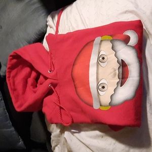 A red Santa Christmas sweater.